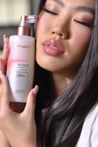 Model holding Mon Platin's One Secret