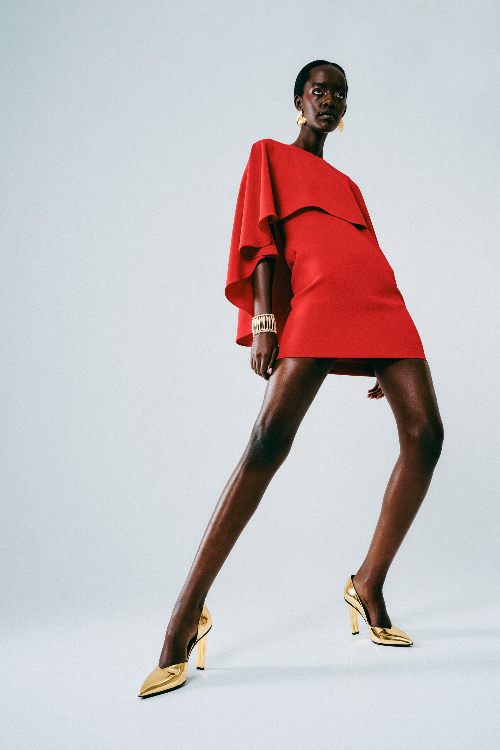 Model wearing SHEWAK Twin D'orsay Pump Gold.