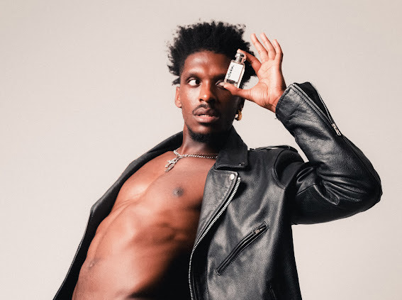 Model holding Echelon perfume