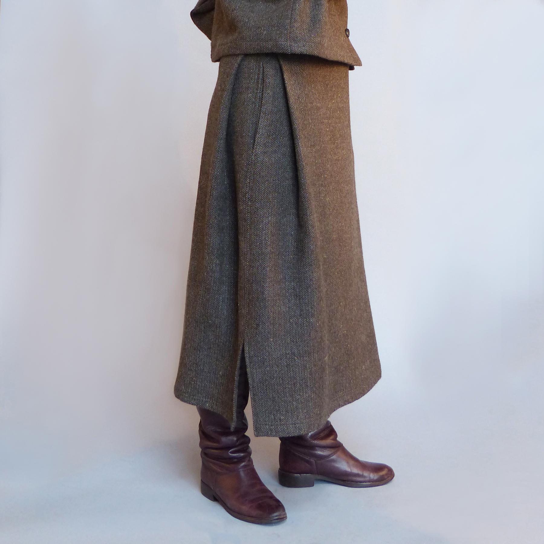 Close-up of handcrafted wool skirt and leather boots by Wave Fibre Mill, featuring natural fibers and sustainable slow fashion design.