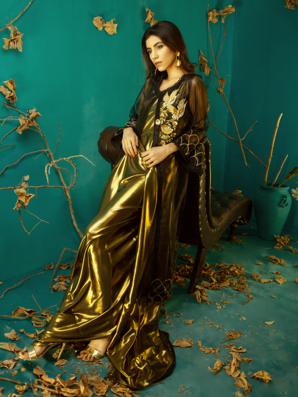Model wearing a gold couture design by SANA EHTASHAM, photographed by Khawer Jadoon