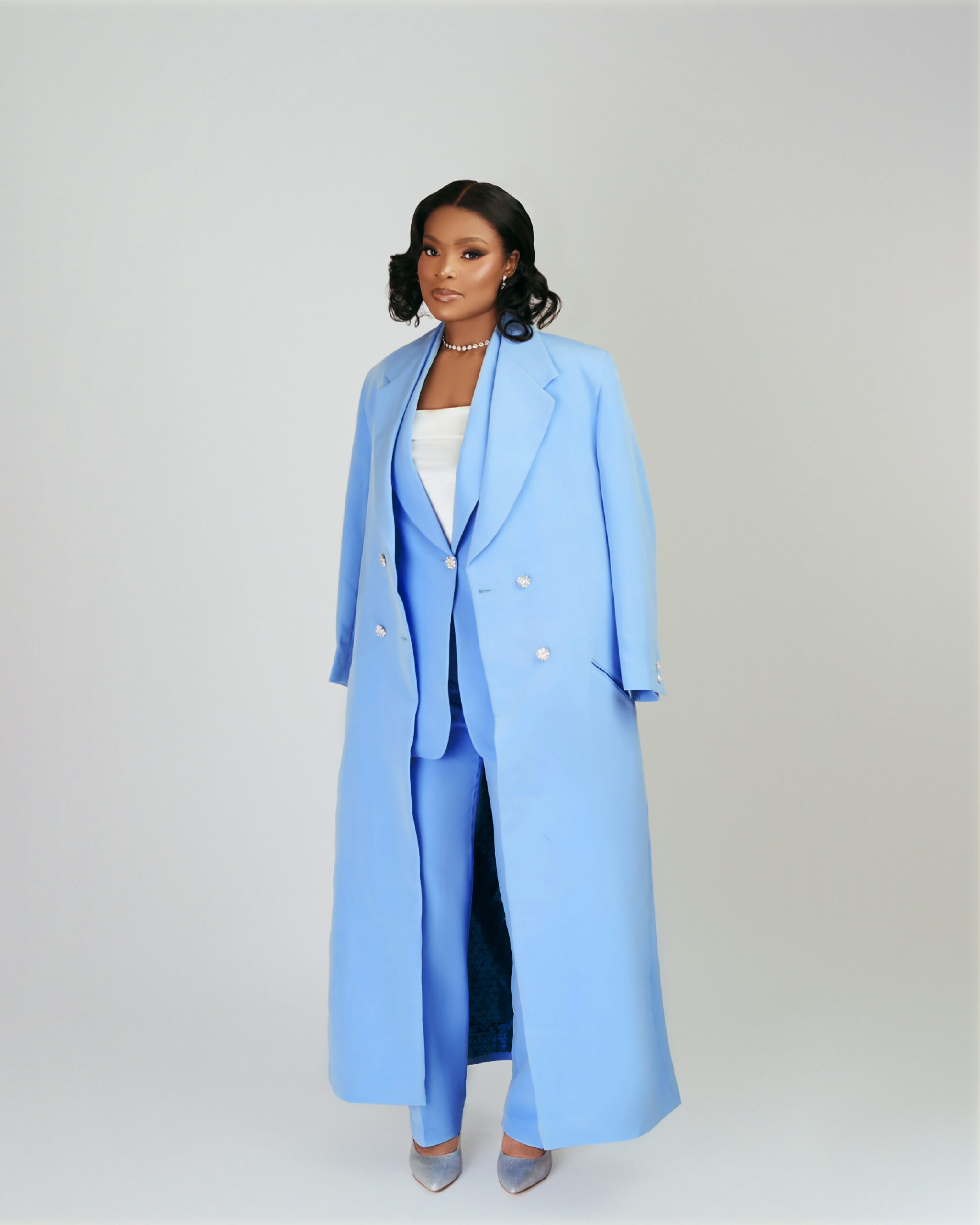 Model wearing a blue tailored suit by OJOYI, designed by Jane Ogbe-Makinwa