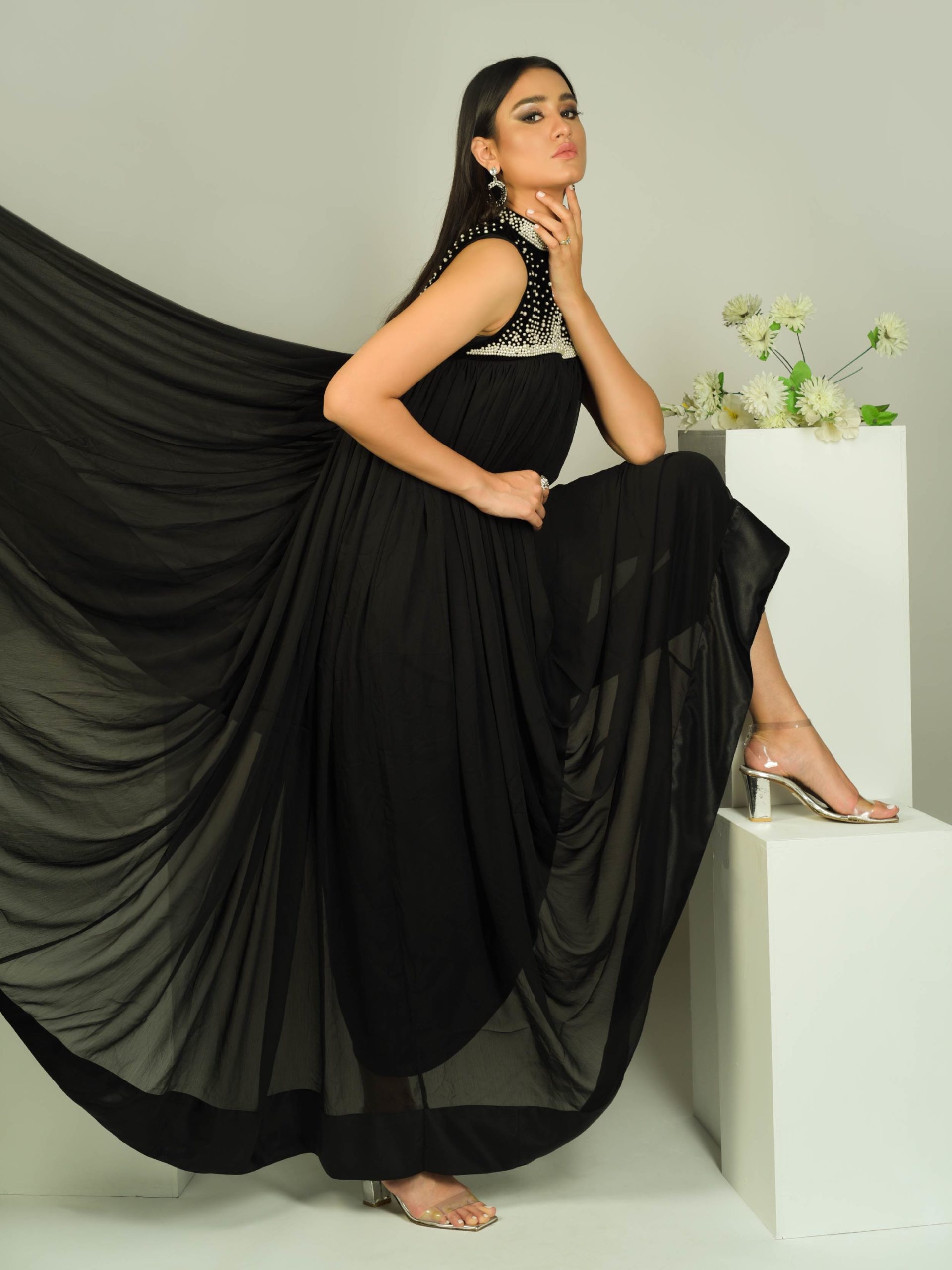 Model wearing an evening gown by SANA EHTASHAM,