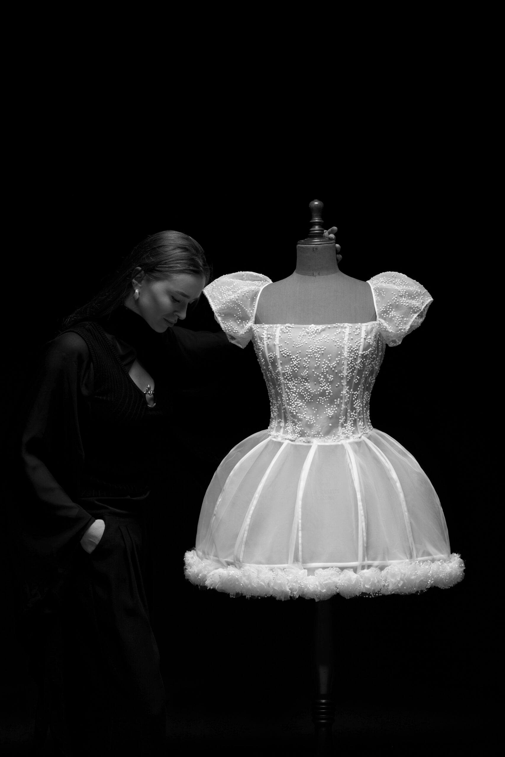 IRA LANGEVIN designer with handcrafted white couture dress from ORIGAMI: 14 FORTUNES collection