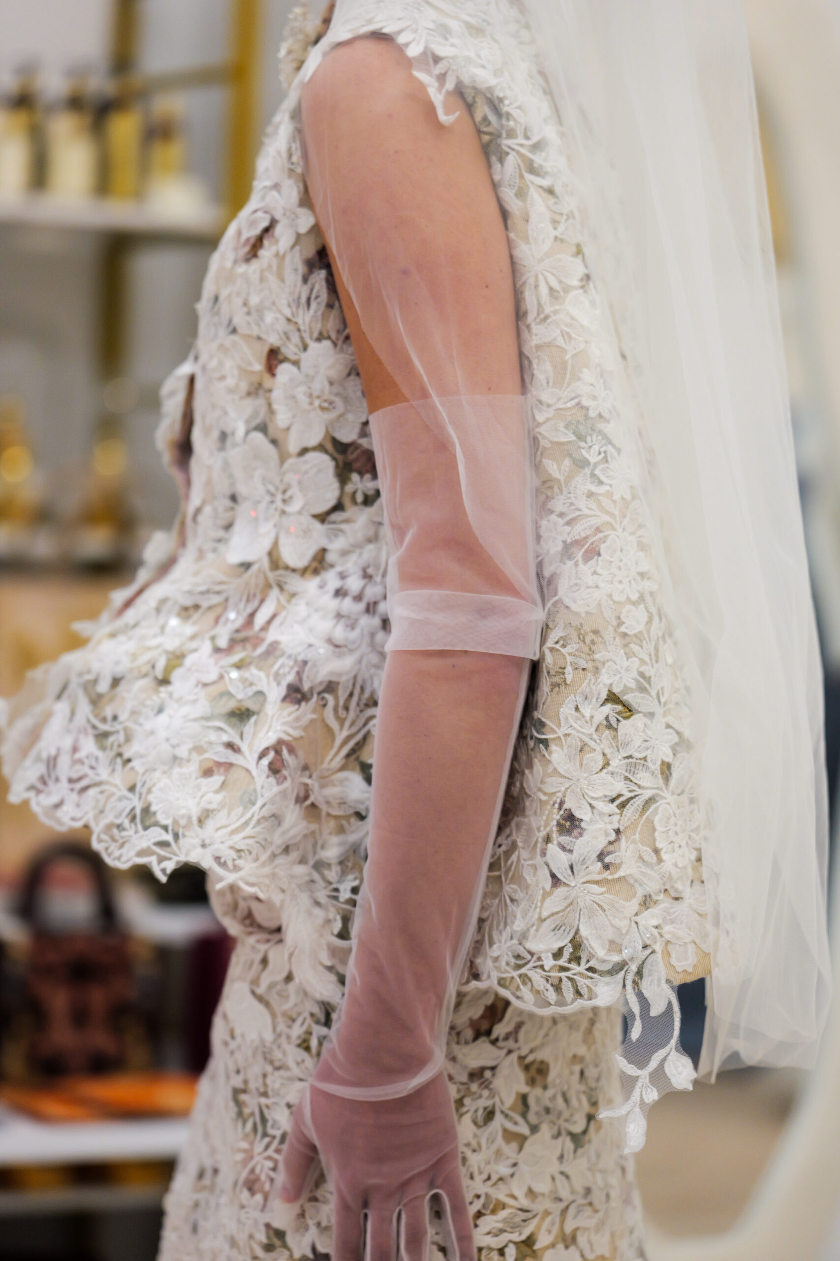 Close-up of Victor dE Souza Bridal Fall 2025 lace sleeve with sheer veil detail