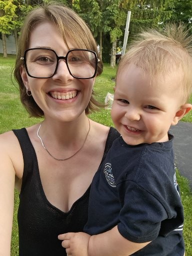 Rébecca Paré smiling with her son outdoorsCaption: Rébecca with her son.