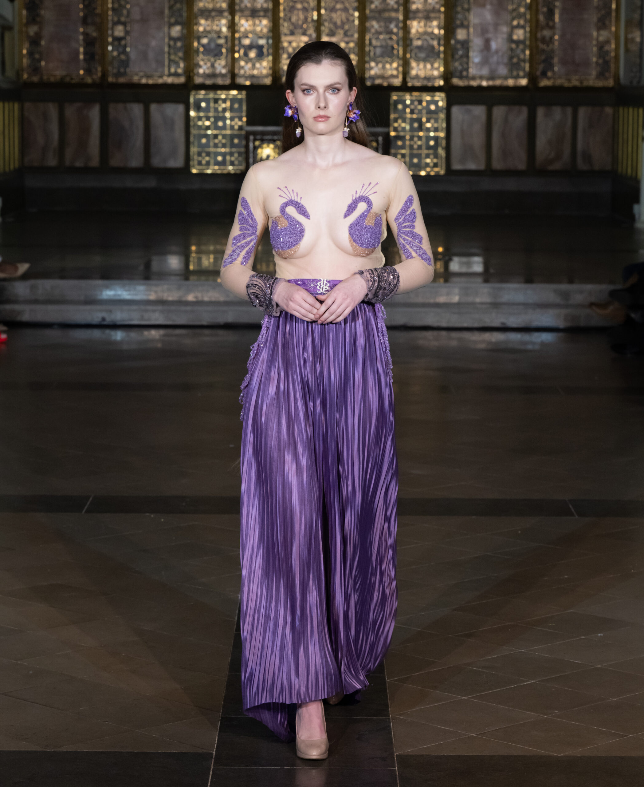 Saanjh by Saloni avant-garde purple pleated skirt with embellished body art at London Fashion Week AW2026 — Fashion Week and the City, St John's Church, Hyde Park.