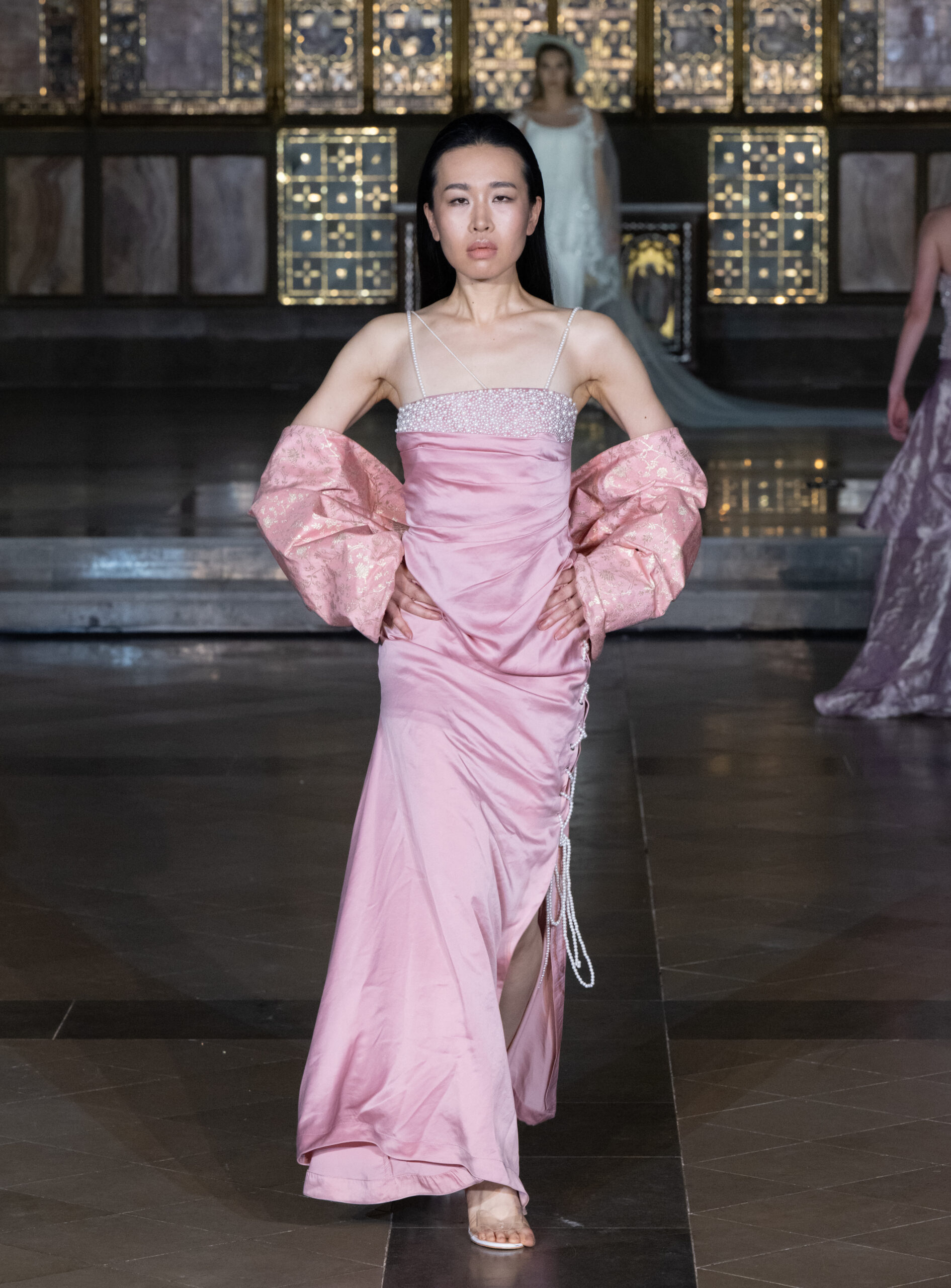 Zavoir by Swarali pink draped gown with pearl embellishments and brocade sleeves at London Fashion Week AW2026 — Fashion Week and the City, St John's Church, Hyde Park.