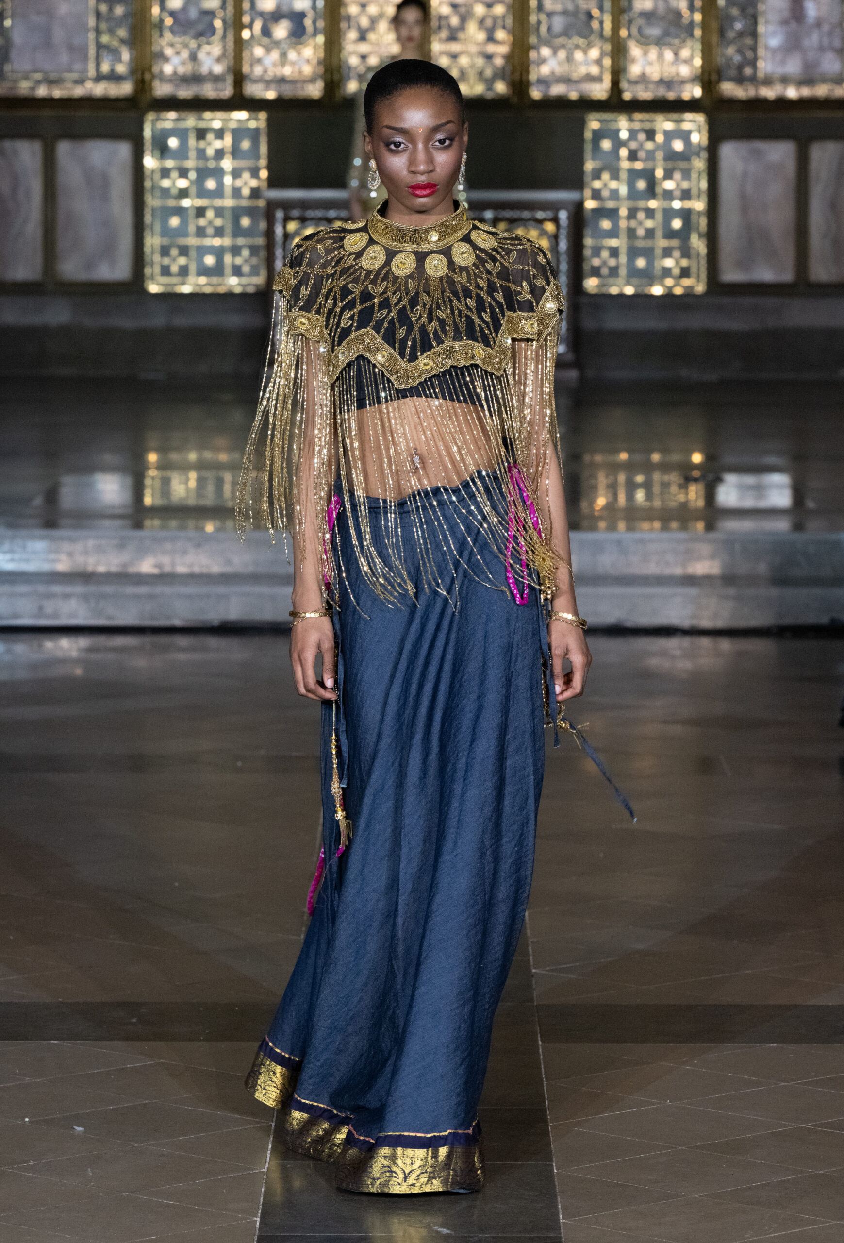 Fashion Week and the City Spotlight Series — gold embellished fringe top with indigo denim maxi skirt at London Fashion Week AW2026, St John's Church, Hyde Park.
