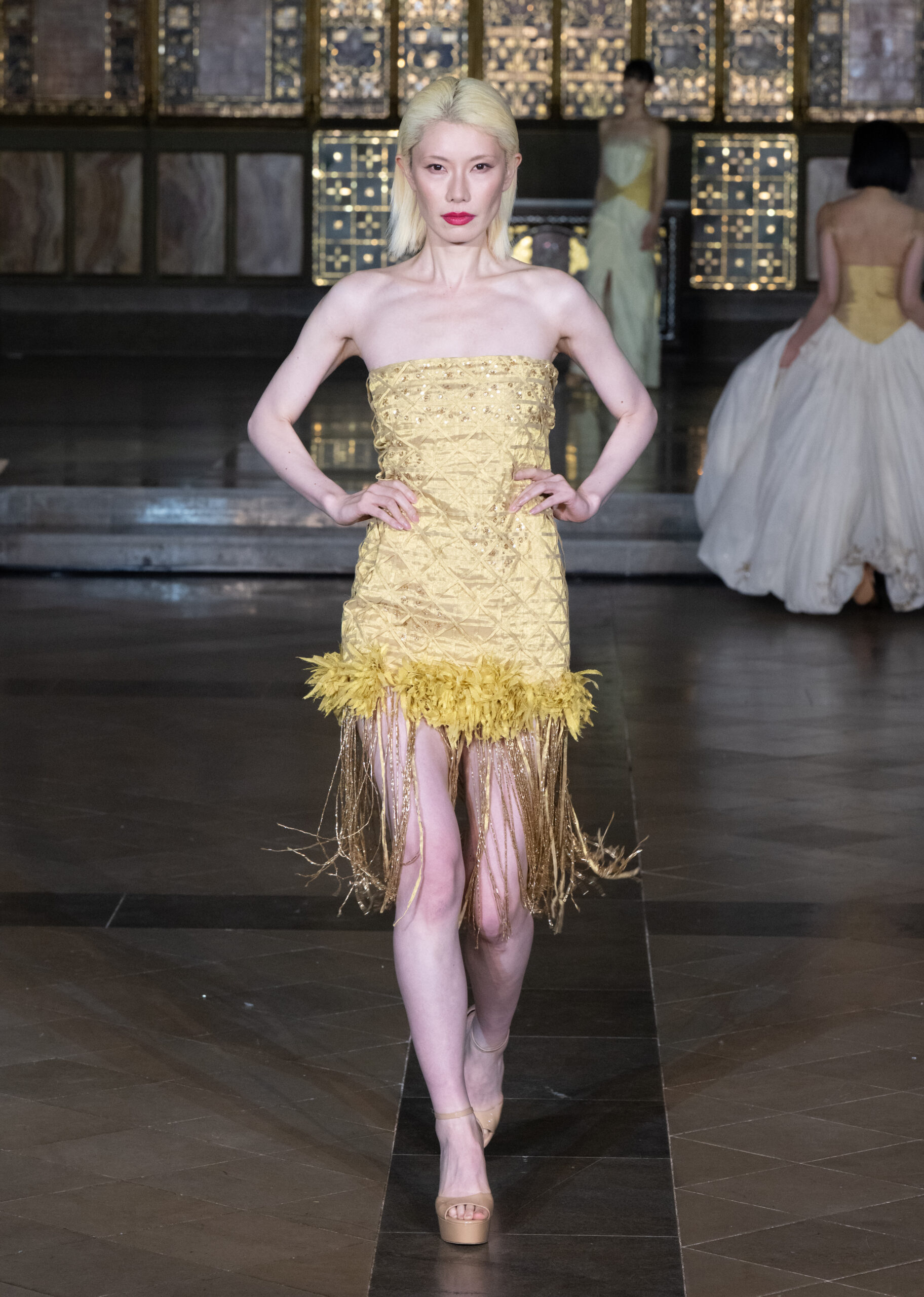 Fashion Week and the City Spotlight Series — yellow textured strapless mini dress with feather and fringe hem at London Fashion Week AW2026, St John's Church, Hyde Park.