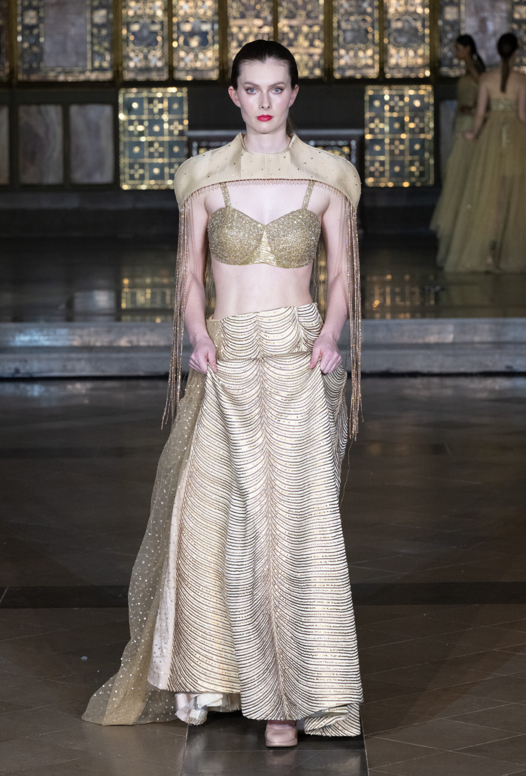 Fashion Week and the City Spotlight Series — gold embellished crop top and beaded fringe skirt at London Fashion Week AW2026, St John's Church, Hyde Park
