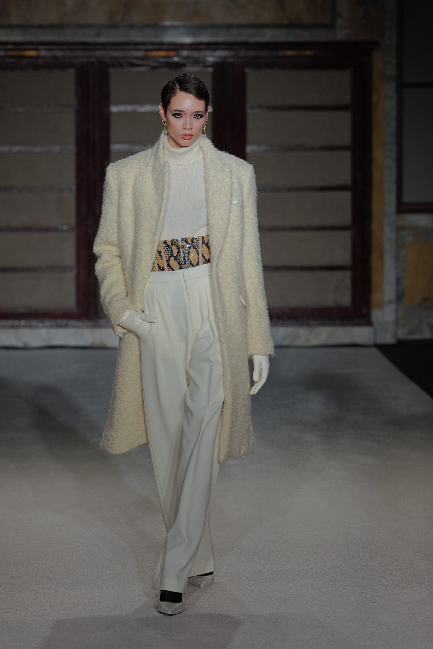 Cream teddy coat snakeskin belt wide-leg trousers textured layers Sergio Hudson FW26