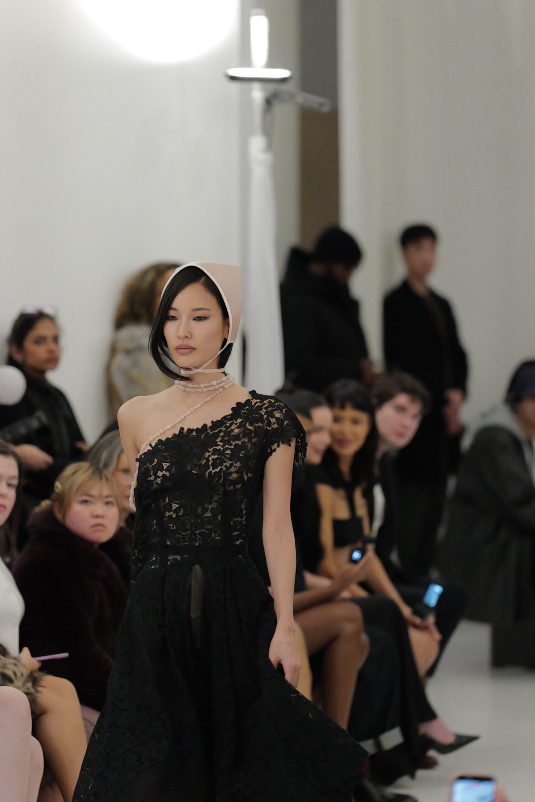 Black lace one-shoulder gown asymmetric pearl necklace Christian Cowan Fall 2026 NYFW