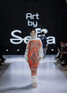 Traditional multicoloured dress with lace detailing
